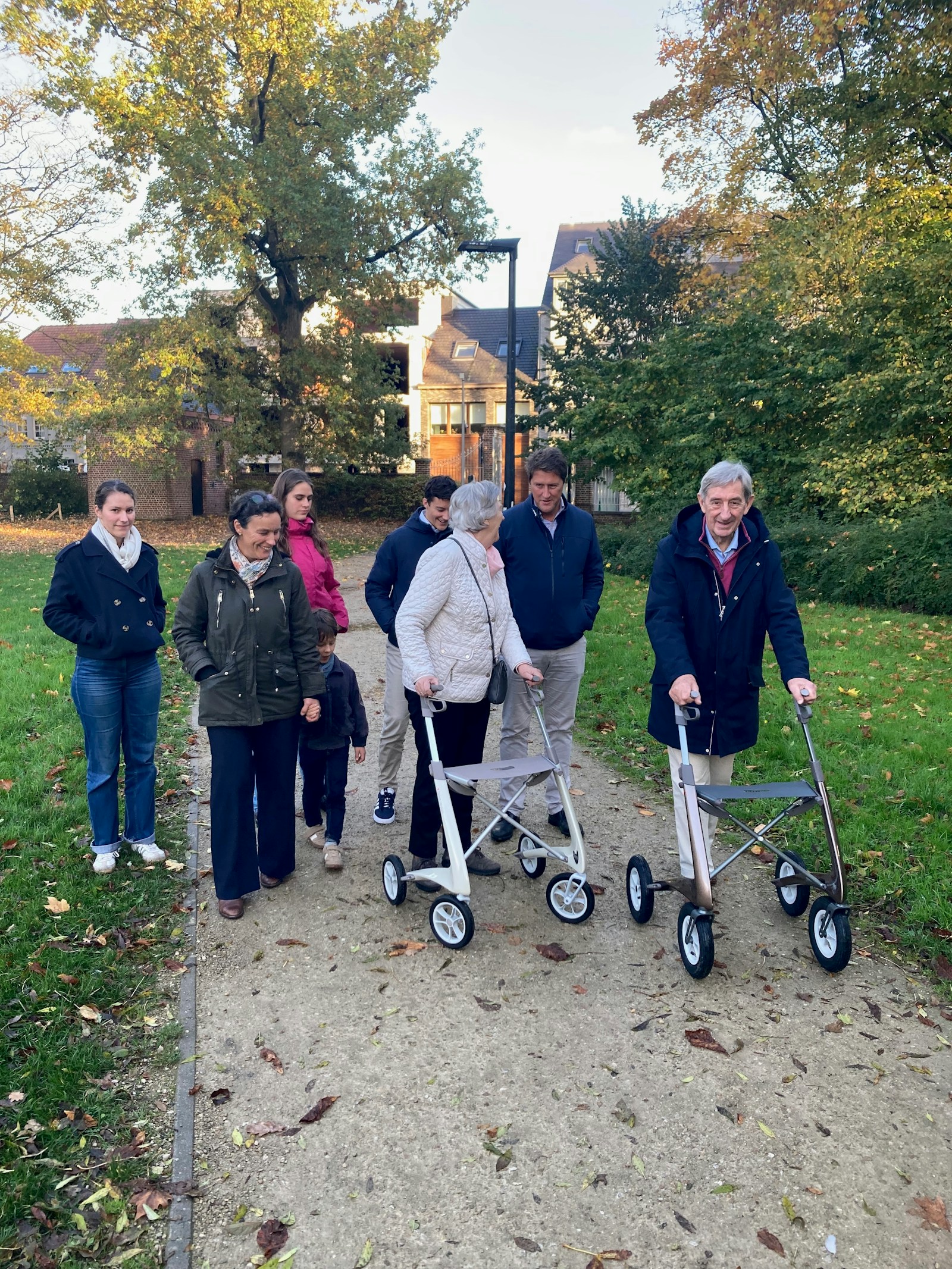 A family enjoying an autumn walk together